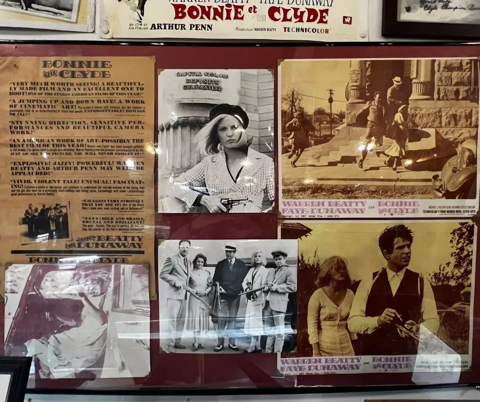 Display of vintage Bonnie and Clyde movie posters, photographs, and promotional stills featuring Warren Beatty and Faye Dunaway.