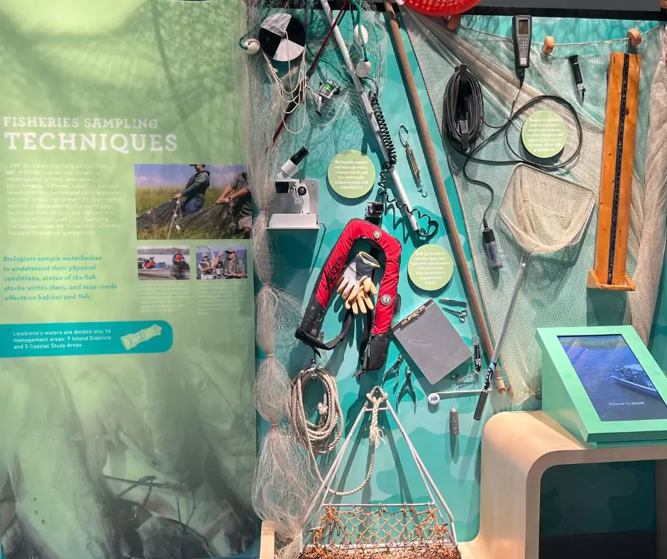 Close-up of fisheries sampling equipment at Port Wonder including nets, sensors, and field tools used by marine biologists.