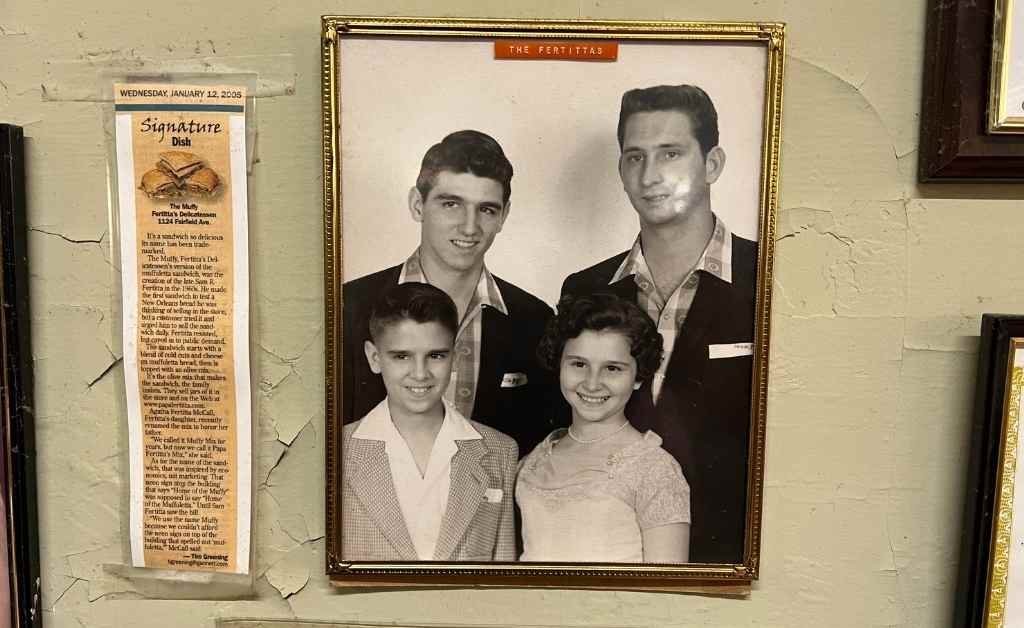 Framed black-and-white photo of the Fertitta children, displayed on the wall inside Fertitta's Deli, representing the next generation of the family legacy.