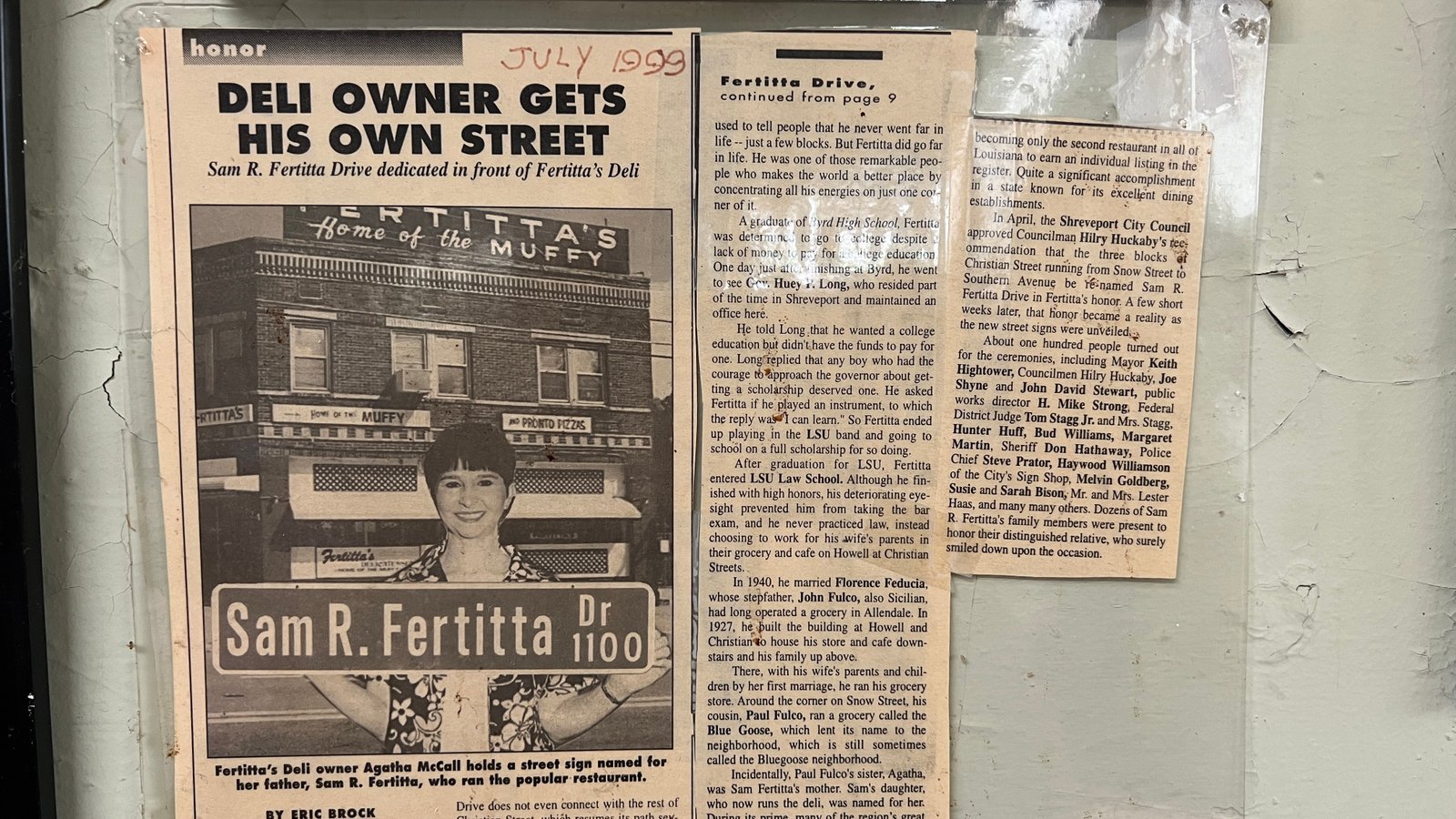 Framed newspaper clipping from July 1999 honoring Sam R. Fertitta with his own street in Shreveport, featuring a photo of Fertitta's Deli and Agatha Fertitta McCall.