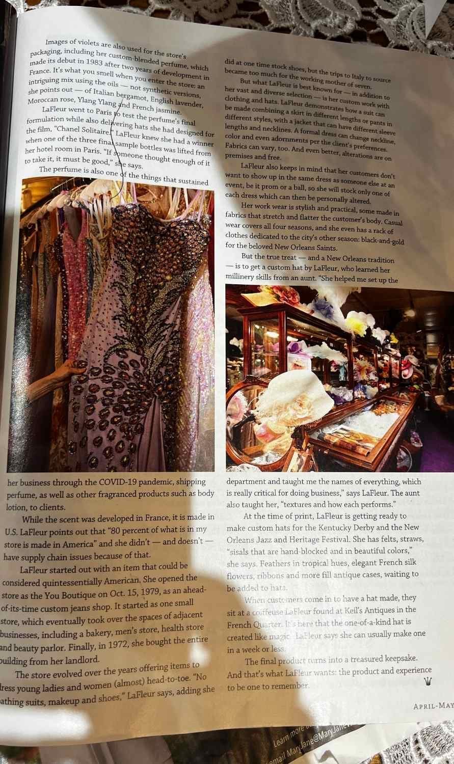 Open magazine spread featuring an article on Yvonne LaFleur, with images of her boutique showcasing gowns and elegant displays.
