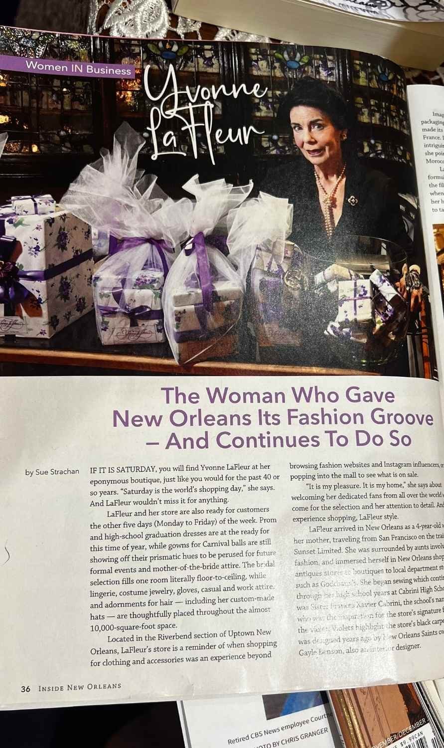 Magazine feature on Yvonne LaFleur highlighting her influence on New Orleans fashion, with her portrait beside gift-wrapped perfume boxes.