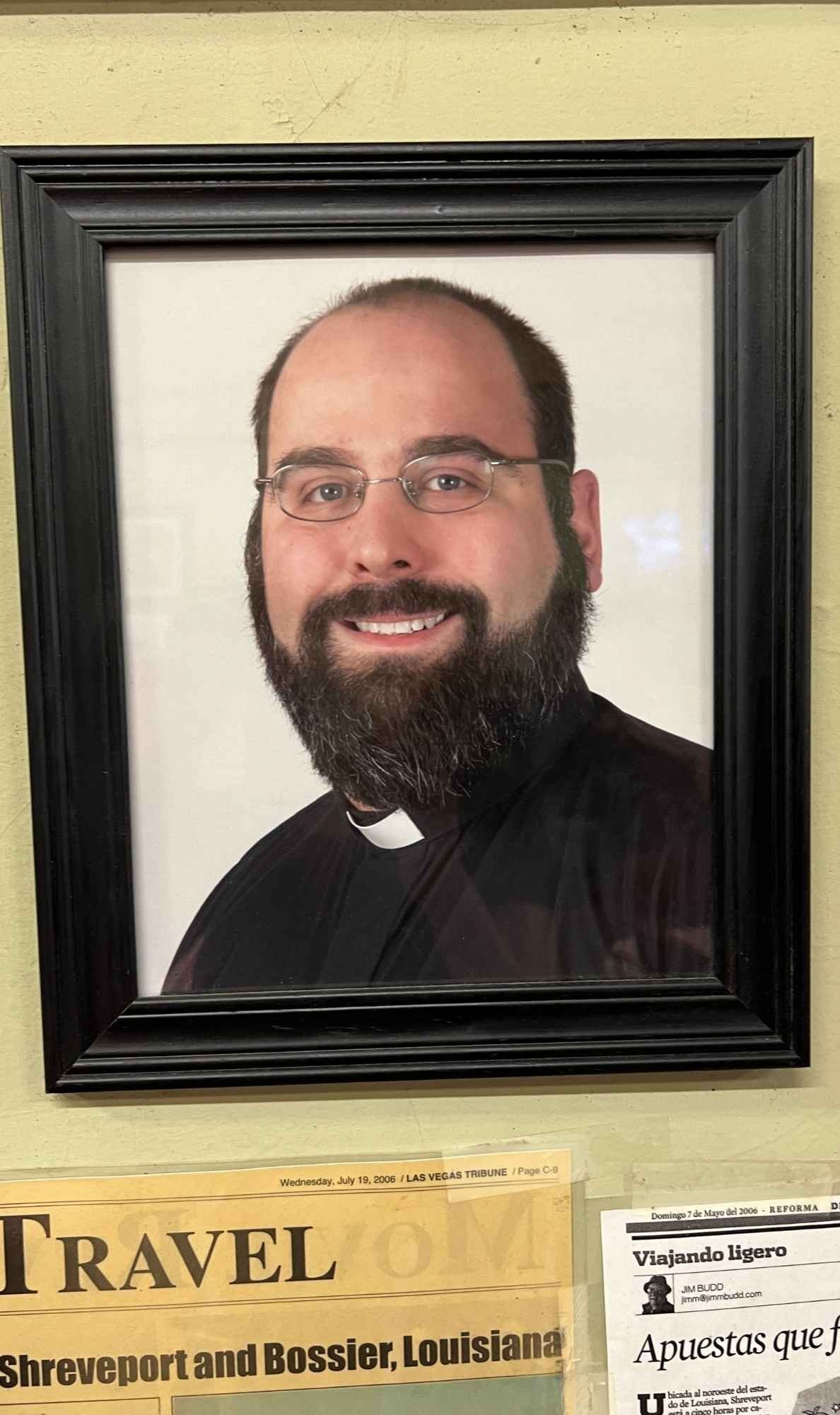 Framed portrait of Reverend Patrick Fertitta, who created the Godfather Sandwich featuring his trademarked alligator Italian sausage, known as the Boss of the Bayou.