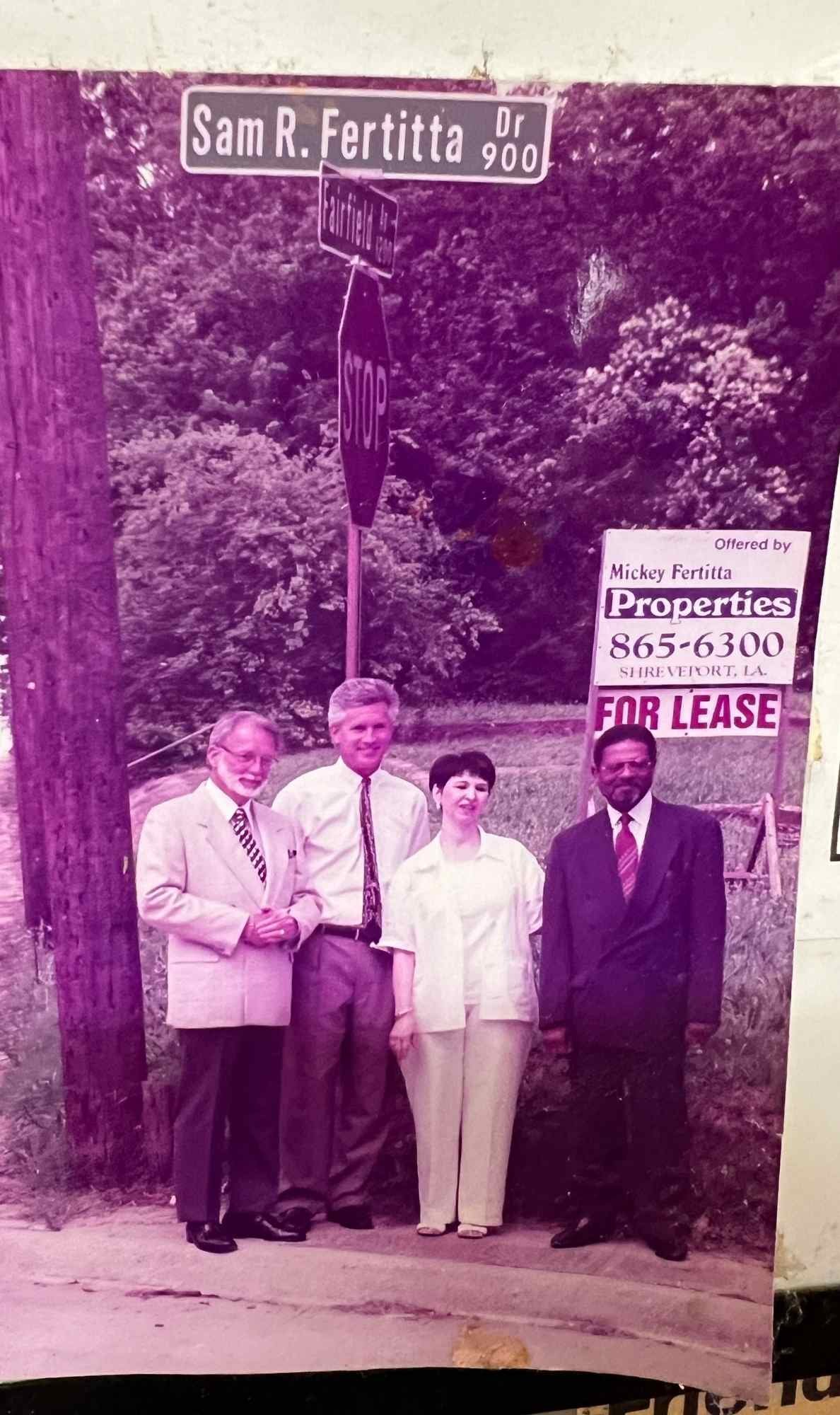 hoto of the dedication ceremony for Sam R. Fertitta Drive in Shreveport, with Agatha Fertitta McCall and community leaders present.
