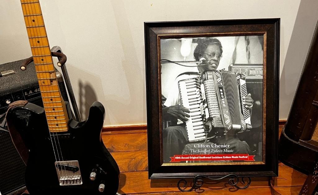 Framed black-and-white photo of Clifton Chenier, known as the King of Zydeco, playing his accordion at the 40th Annual Original Southwest Louisiana Zydeco Music Festival.