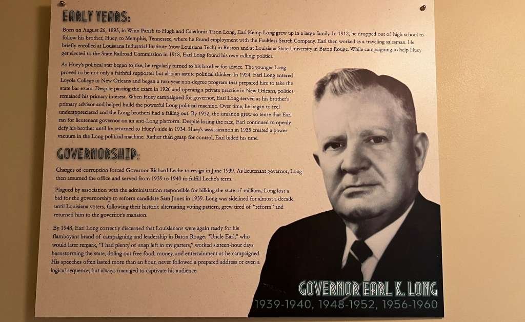 An informational display panel featuring a black-and-white photo of Governor Earl K. Long in a suit and tie. The text details his early life, political career, and multiple terms as governor of Louisiana from 1939–1940, 1948–1952, and 1956–1960.