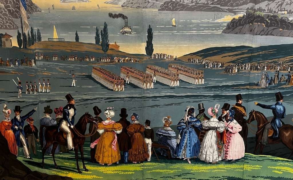 Close-up view of the rare French Zuber wallpaper in the Old Governor's Mansion dining room, depicting 19th-century figures watching military formations by a riverfront, with detailed historic American landscapes and period costumes.
