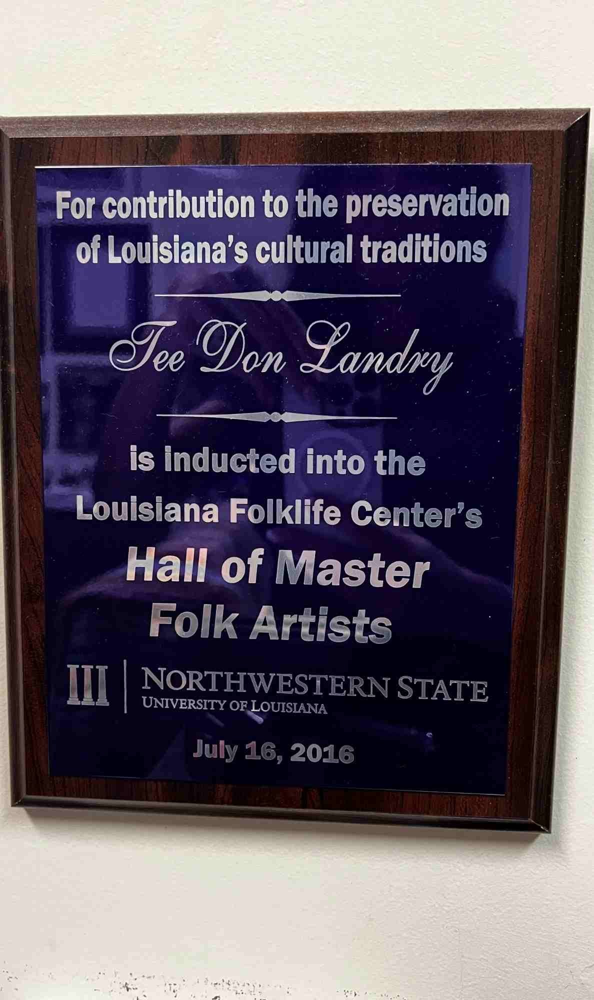 Plaque honoring Tee Don Landry’s induction into the Louisiana Folklife Center’s Hall of Master Folk Artists for his contributions to preserving Louisiana’s cultural traditions, awarded by Northwestern State University on July 16, 2016.