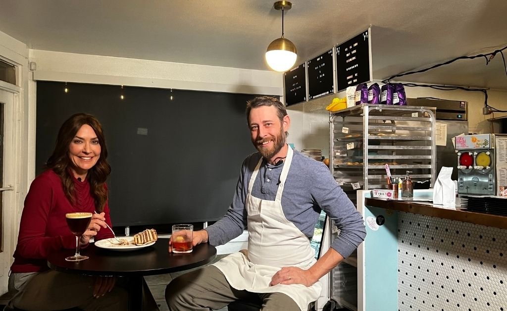 Karen LeBlanc enjoying dessert and a drink with the owner inside Debbie on the Levee in Kenner.