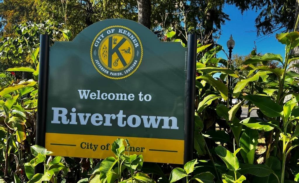 Welcome to Rivertown sign surrounded by greenery in Kenner, Louisiana.