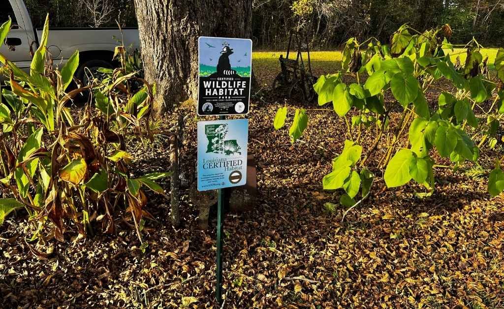 Certified wildlife habitat signs posted among native plants at Cajun Prairie Farm in Arnaudville, Louisiana.