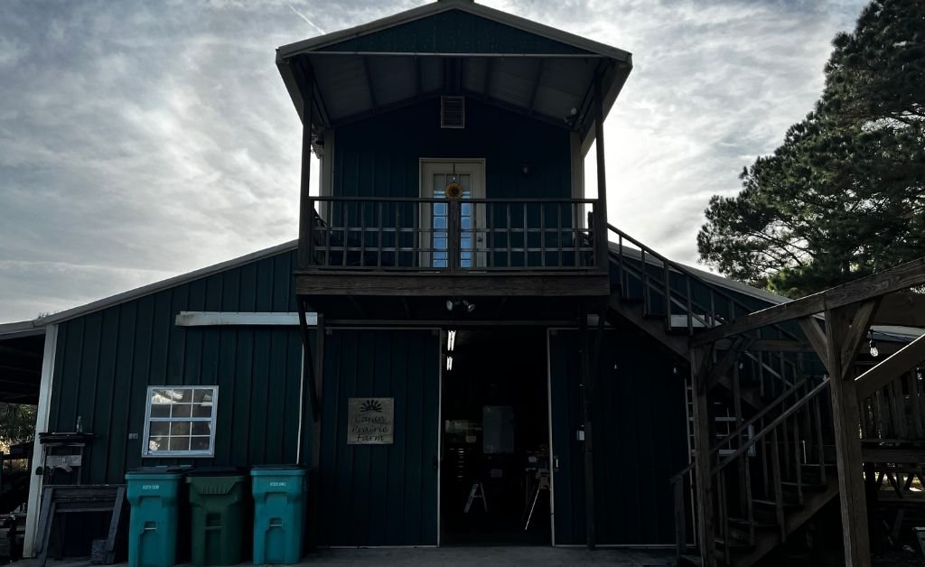 Exterior view of the barndominium Airbnb at Cajun Prairie Farm in Arnaudville, Louisiana, set on the working farm.