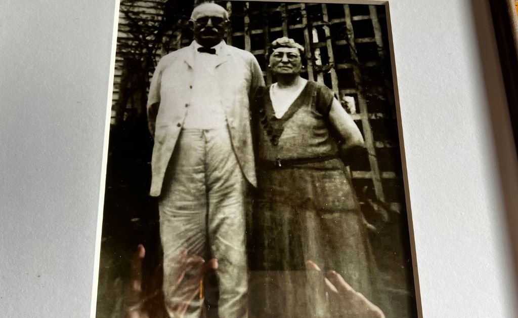 Historic black-and-white photograph of Max Klaus and Sarah Wolff standing in the backyard of the Klaus Building in Washington, Louisiana, circa 1910–1920.