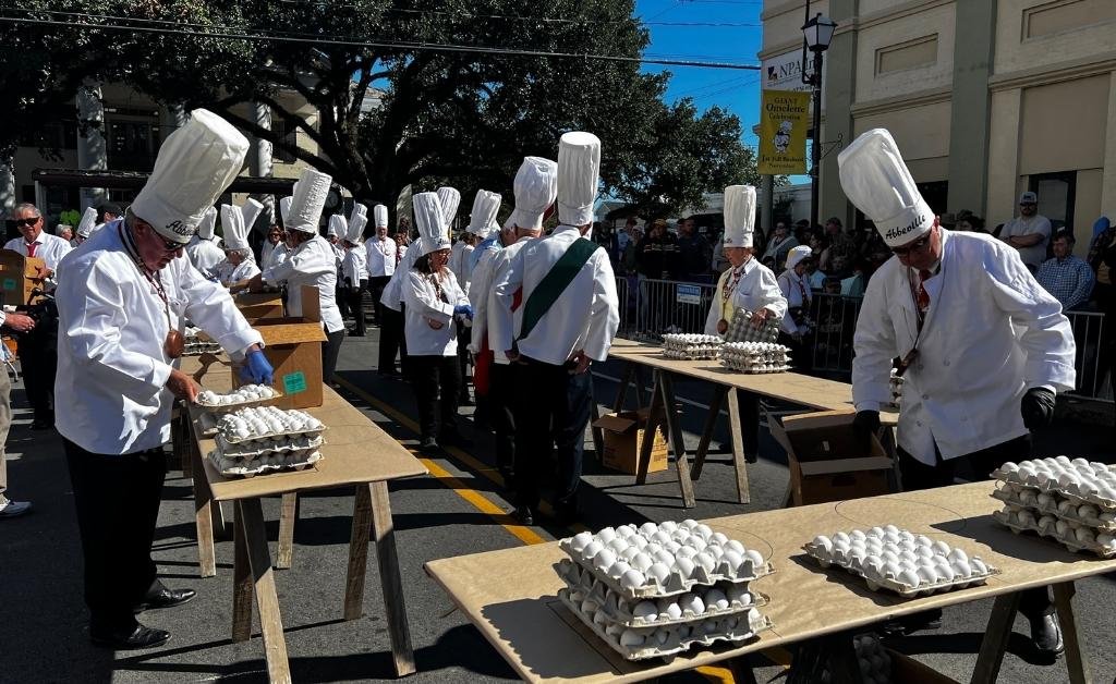Members of the Omelette Confrérie prepare thousands of eggs before cooking the giant omelette in downtown Abbeville