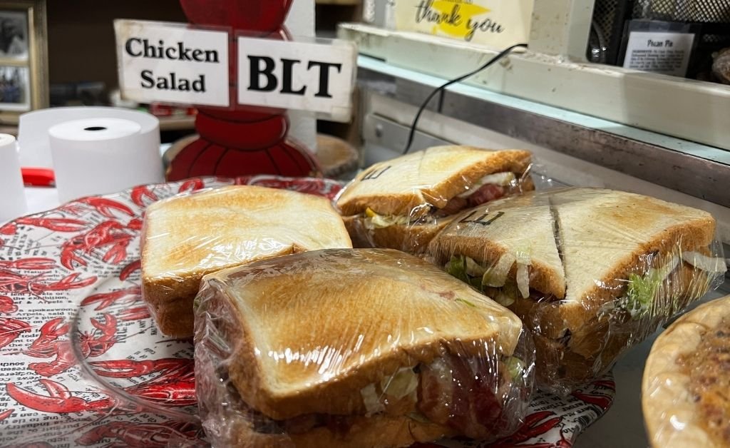 Wrapped BLT sandwiches prepared for grab-and-go service at Suire's Grocery and Restaurant