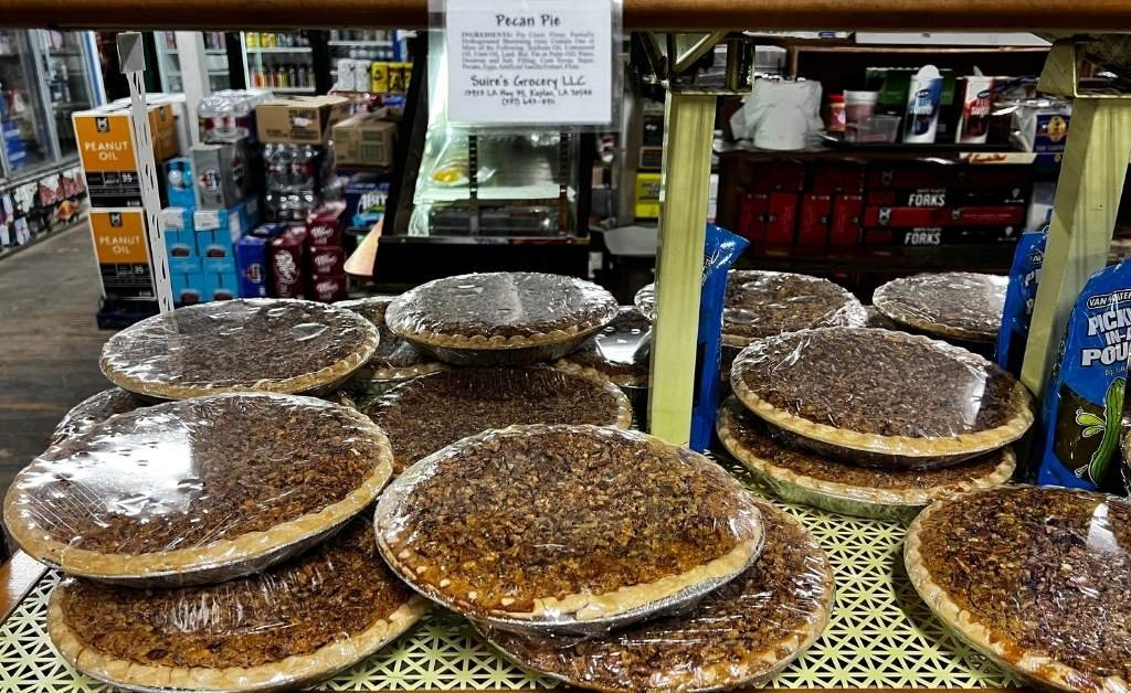 Stacks of homemade pecan pies wrapped for sale at Suire's Grocery and Restaurant