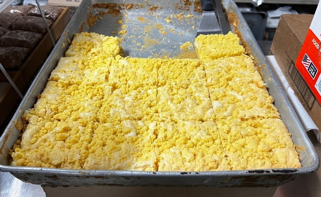 Freshly baked cornbread cooling in a pan at Suire's Grocery and Restaurant