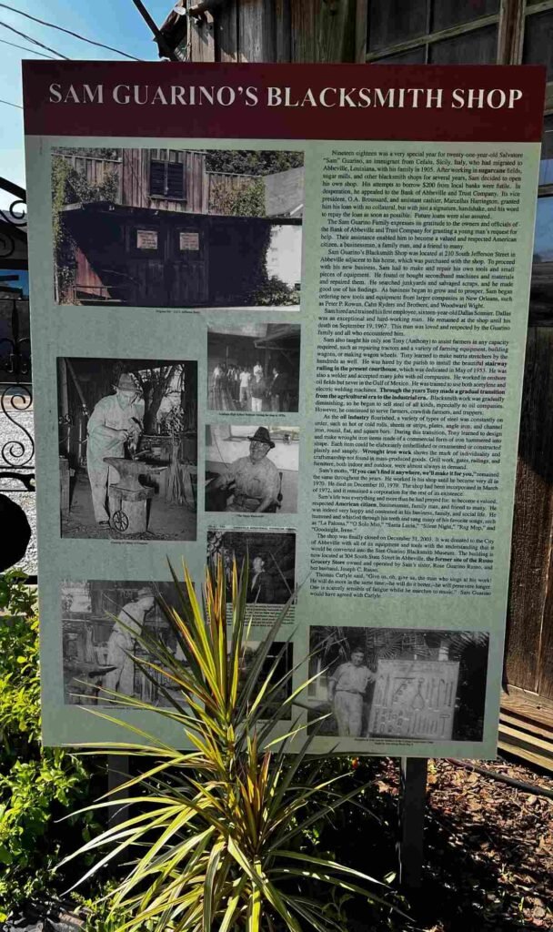 Interpretive sign detailing the history of Sam Guarino’s Blacksmith Shop in downtown Abbeville, Louisiana.