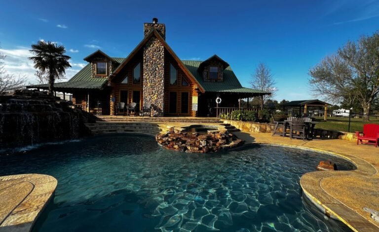 God's Country RV Park: Frontier-style camping lodge with a luxury stone fireplace, lagoon-style swimming pool, and waterfall near Shreveport, Louisiana.