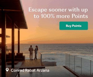 A couple walking on a beach at sunset at Waldorf Astoria Monarch Beach Resort & Club. Text: Escape sooner with up to 100% more Points. Buy Points button.